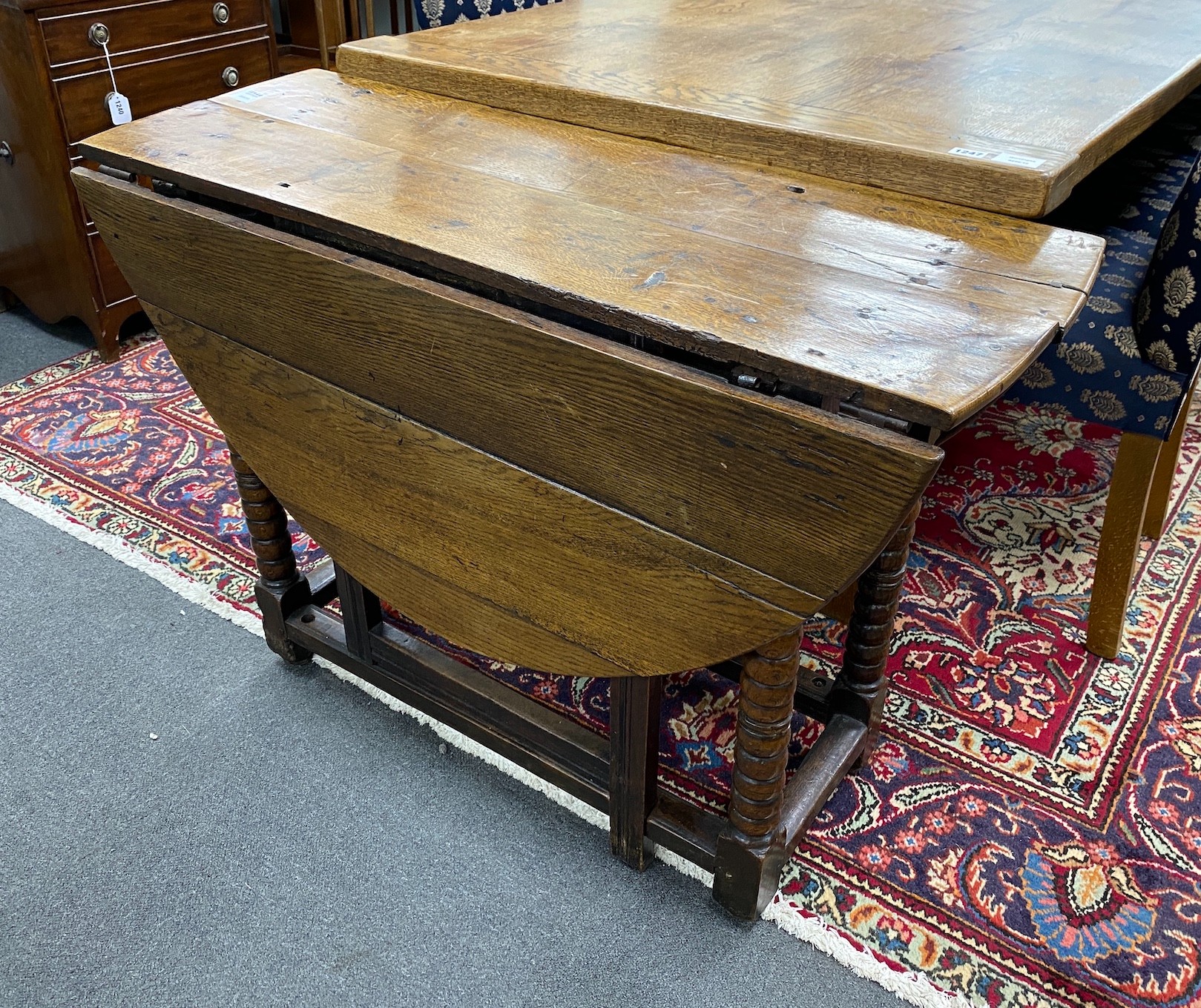 An 18th century oak bobbin turned gateleg table, width 102cm, depth 38cm, height 72cm
